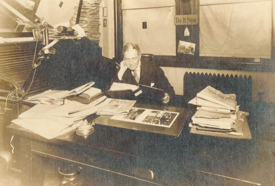 a man checking files in the office.