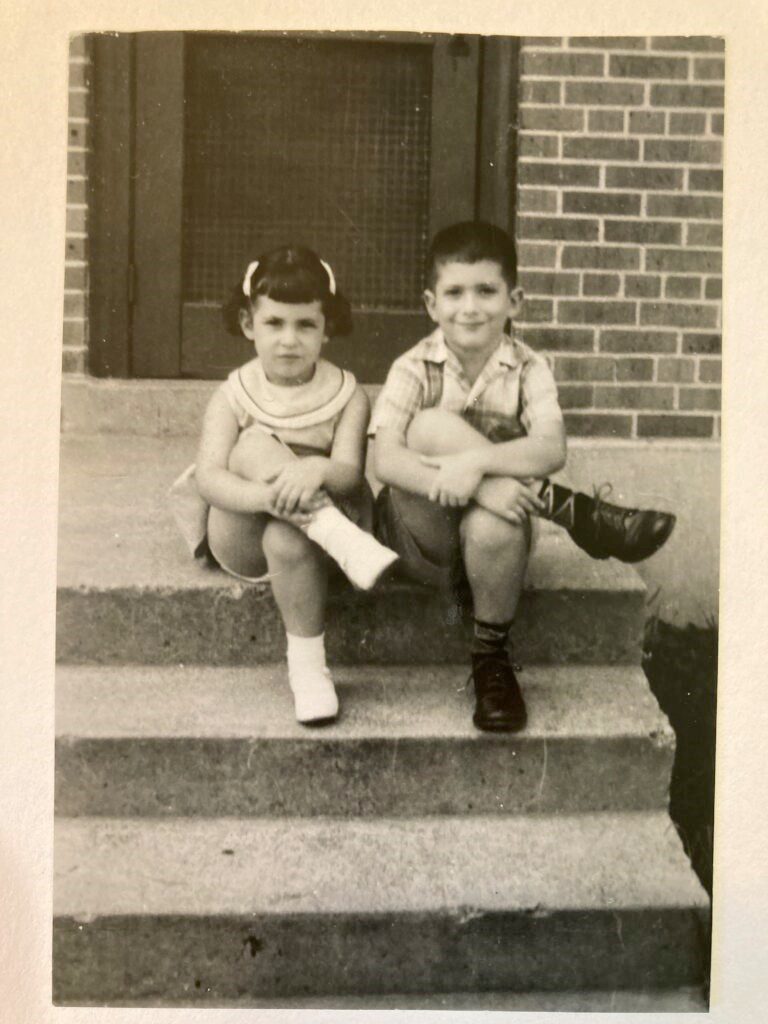 Marlene and her brother Bob on the steps of their home in New Orleans