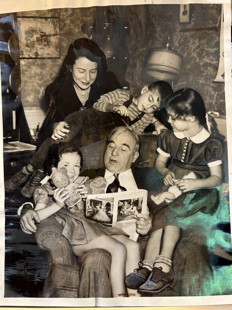 Harry Ginsburg reads to Ethel Miron, Herbert Freedman and Sylvia Spillman as alumna Jean Segal Avegno listens, 1942