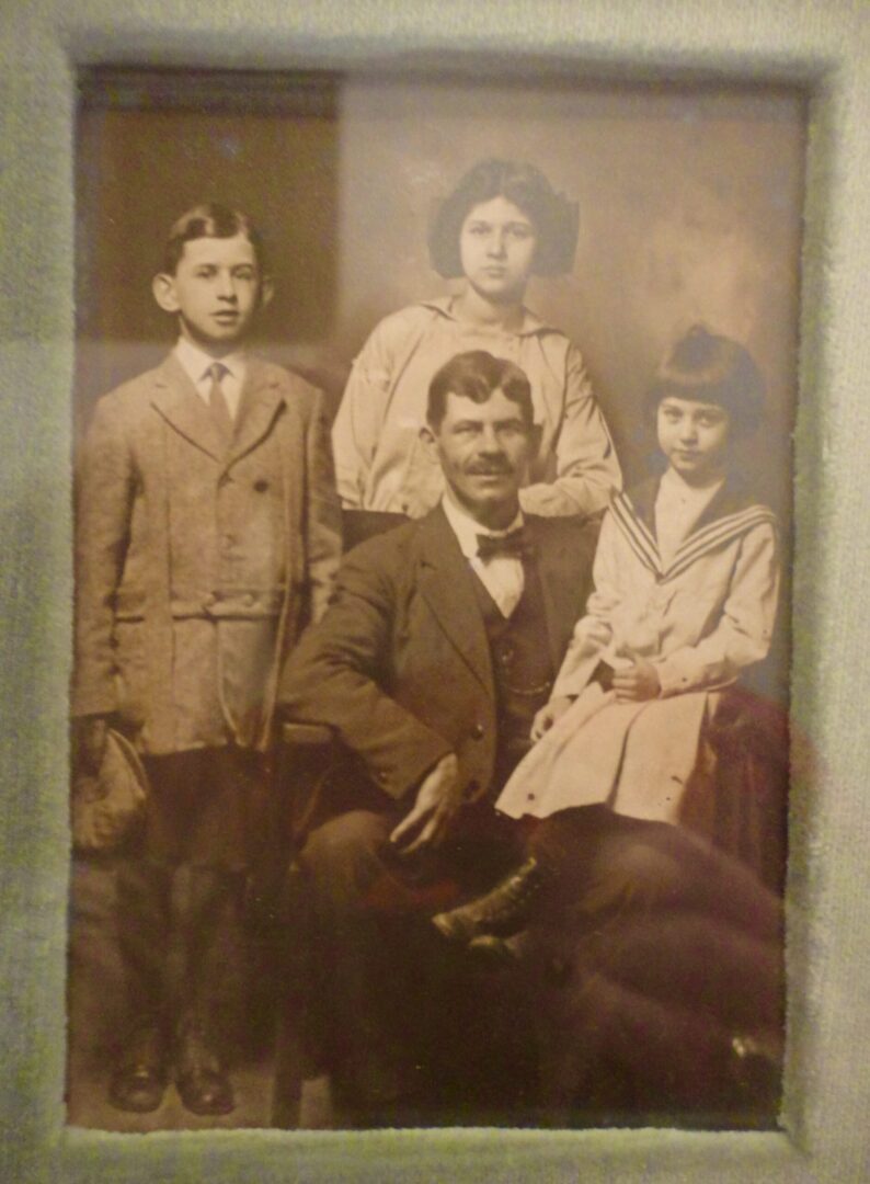 Bernard, Lena, and Annie Schneider with their father Morris, c. 1910