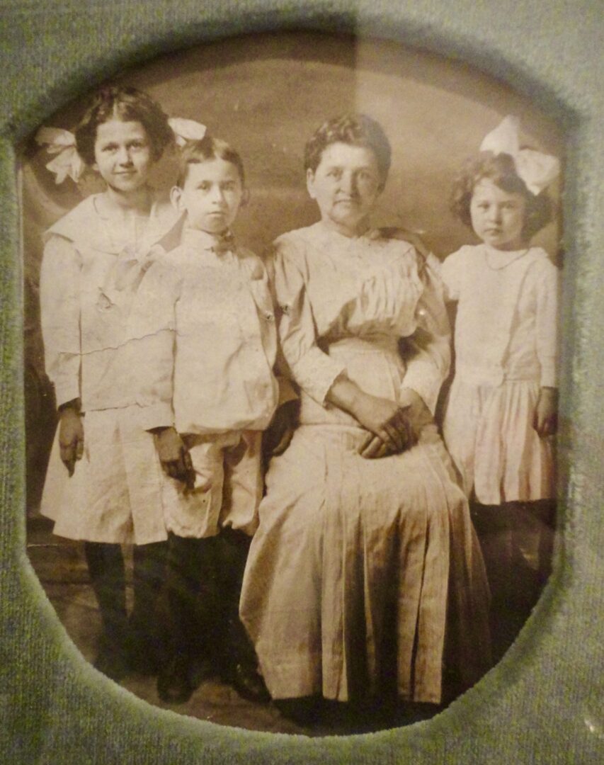 Lena, Bernard, and Annie Schneider with their mother, c. 1910