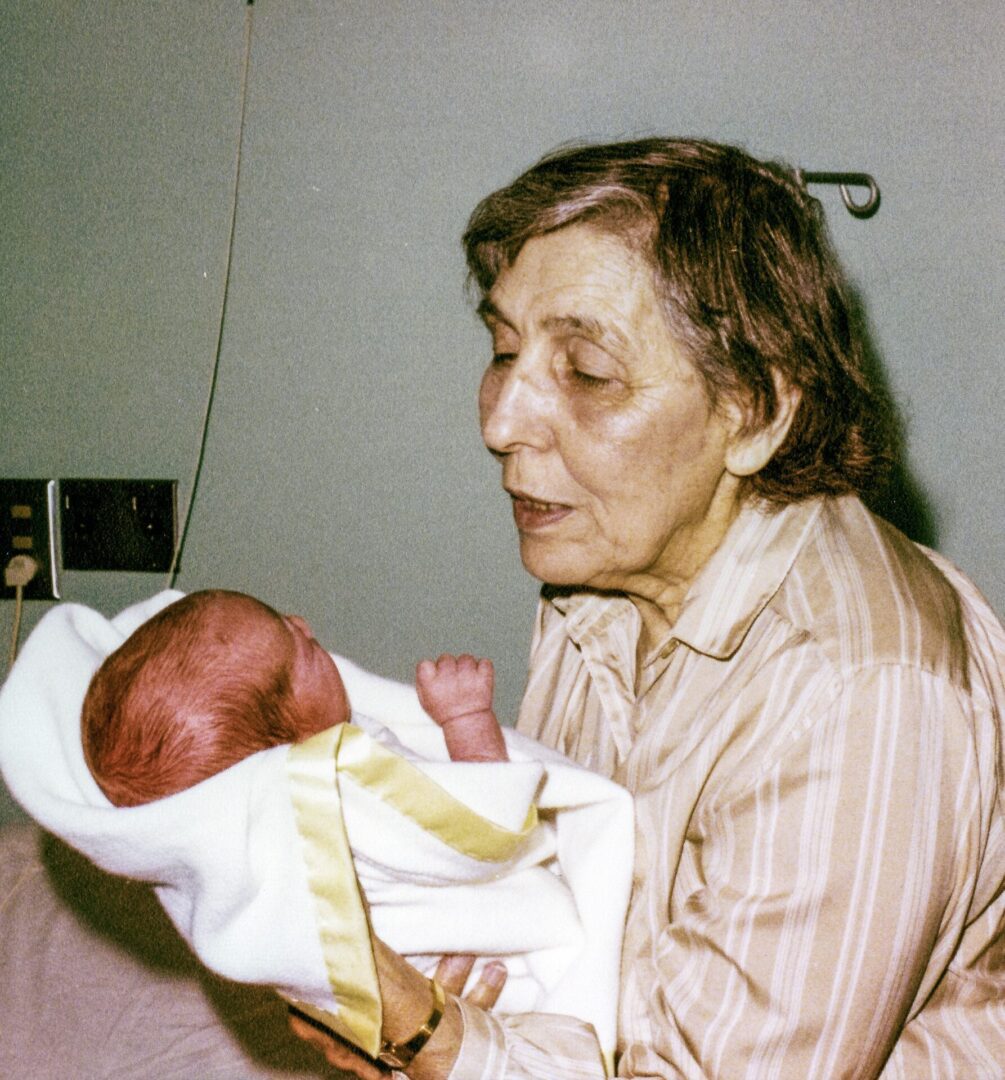 Rebecca Weinberg Queyrouze, holding grandson Terrence O'Connor, 1981