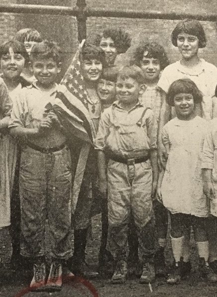 Etta Miller at back with dark wavy hair