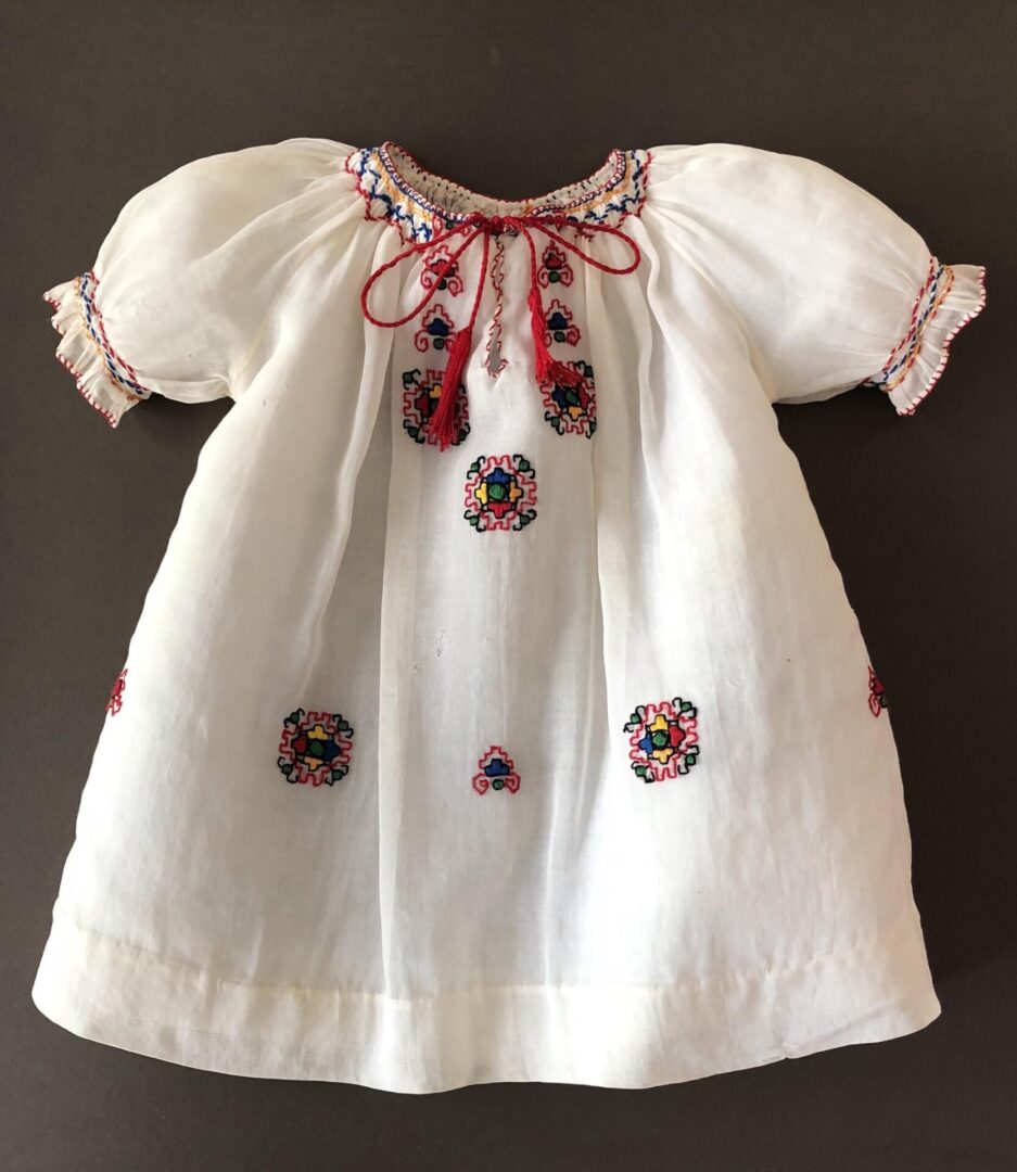 Baby dress, gift from Libby Berkowitz to Miriam Tannenbaum