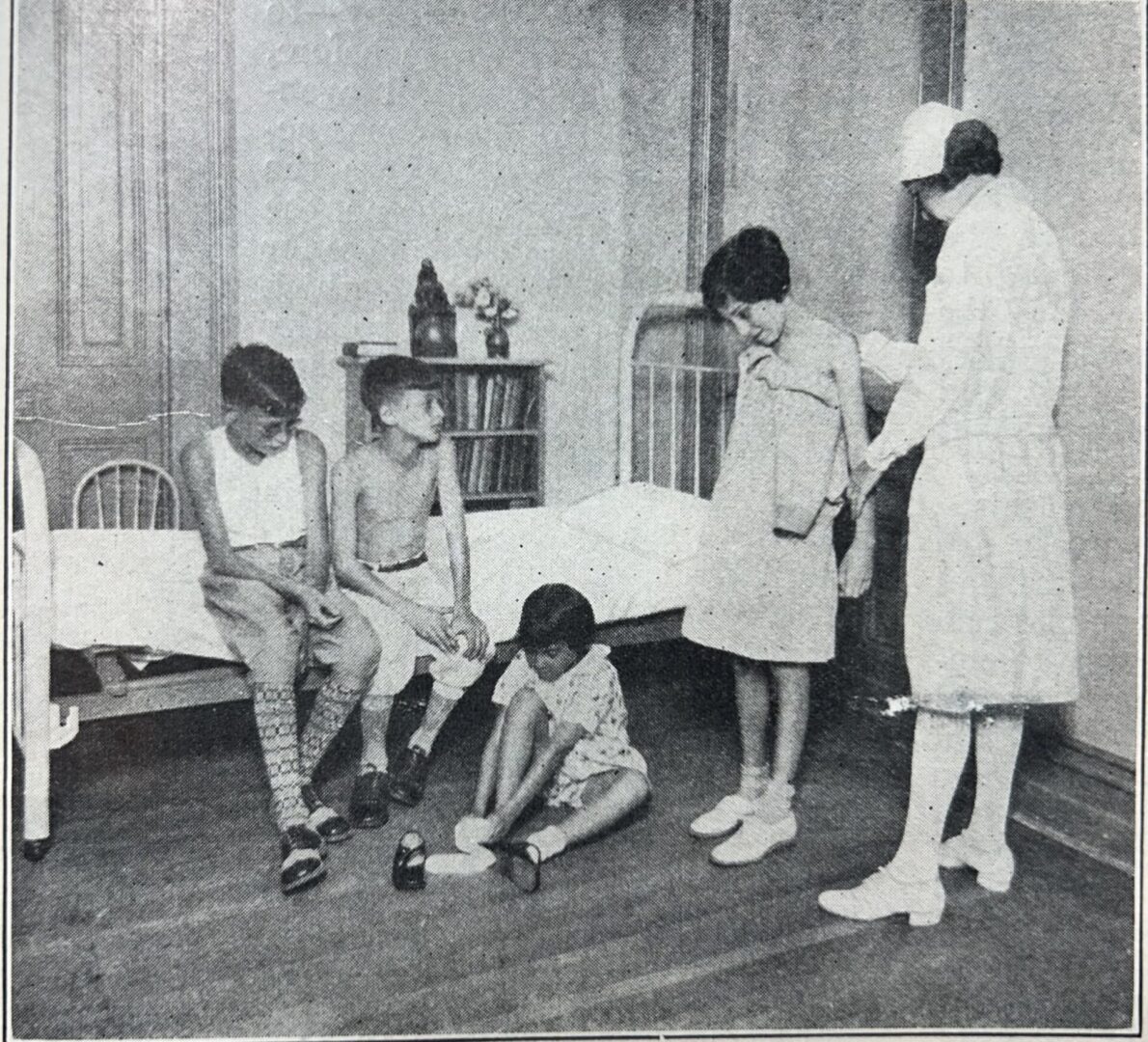 Helen Gold being examined by Nurse Anna Levine Kamin, GCM 1932.