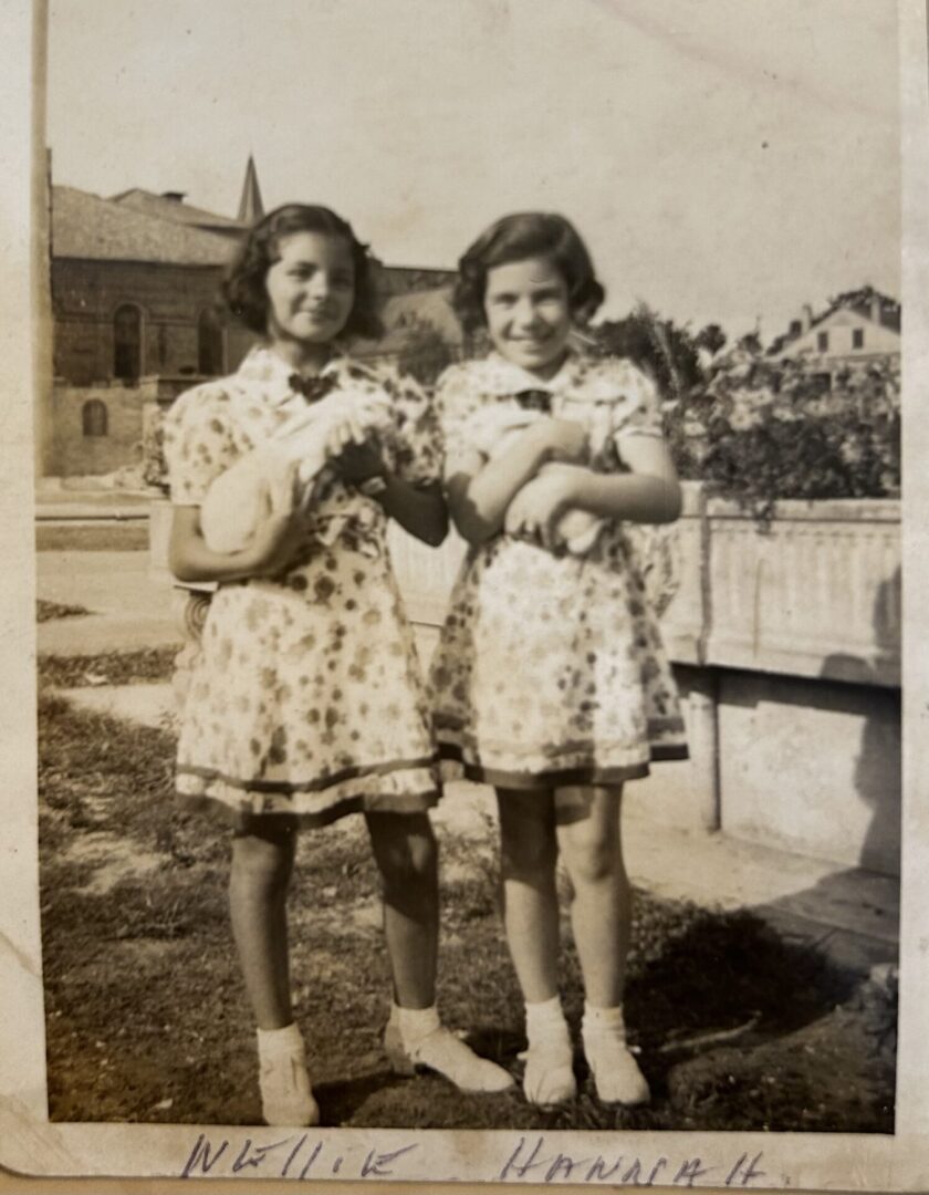 Nellie Skalka (left) and Hannah Golden, c. 1939, with pet guinea pigs (or rabbits?) in the Home's backyard.